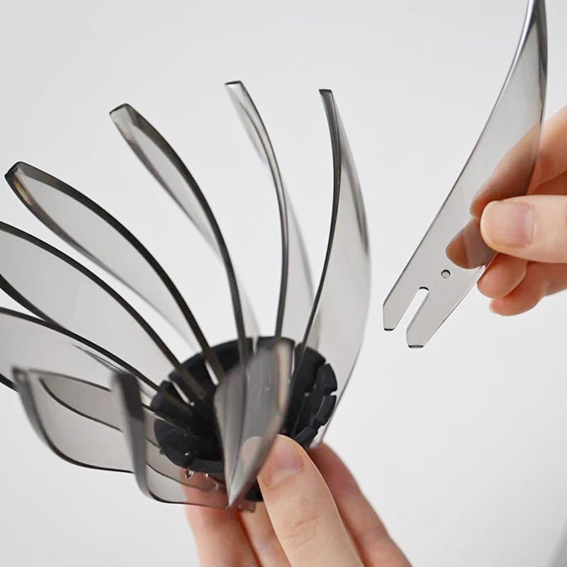 Hario Suiren held by a hand against a white background